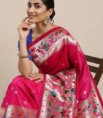 Coral coral & gold-toned ethnic motifs woven design zari saree