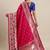 Coral coral & gold-toned ethnic motifs woven design zari saree