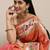 coral coral & gold-toned ethnic motifs silk blend saree