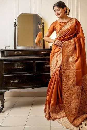 orange ethnic motif woven design tassel saree