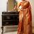 orange ethnic motif woven design tassel saree