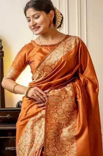 orange ethnic motif woven design tassel saree