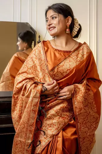 orange ethnic motif woven design tassel saree