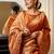 orange ethnic motif woven design tassel saree