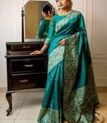 teal ethnic motif woven design tassel saree