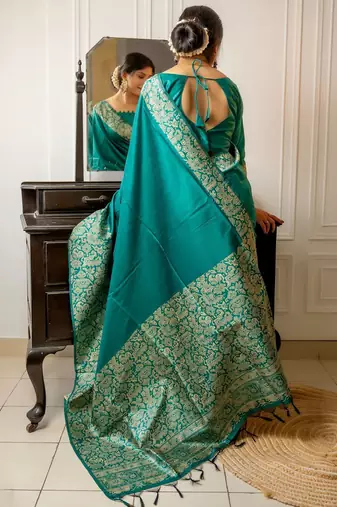 teal ethnic motif woven design tassel saree