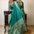teal ethnic motif woven design tassel saree