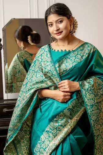 teal ethnic motif woven design tassel saree