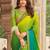 Green embroidered satin saree with unstitched blouse piece