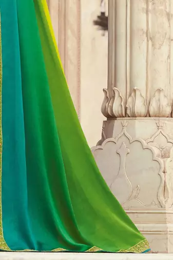 Green embroidered satin saree with unstitched blouse piece
