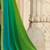 Green embroidered satin saree with unstitched blouse piece