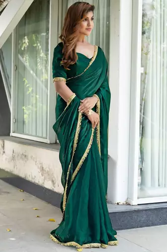 green embroidered satin saree with unstitched blouse piece