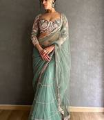 sea_green embellished embroidered net saree with unstitched blouse piece