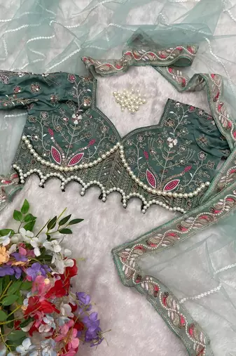 sea_green embellished embroidered net saree with unstitched blouse piece