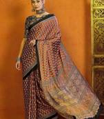 rust ethnic motifs satin block print saree