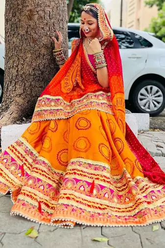yellow yellow & red printed gotta patti bandhani saree