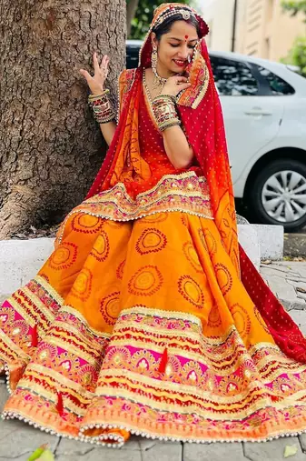yellow yellow & red printed gotta patti bandhani saree