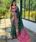 green green & pink woven design ethnic motifs zari silk blend patola saree