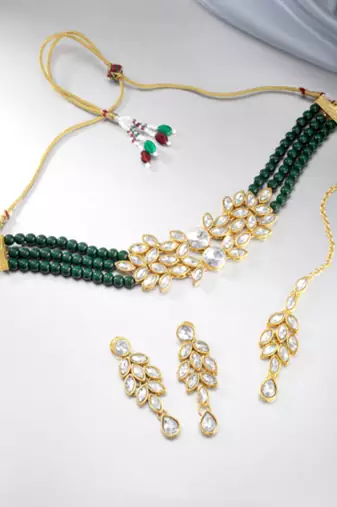 green & gold-toned kundan studded jewellery set