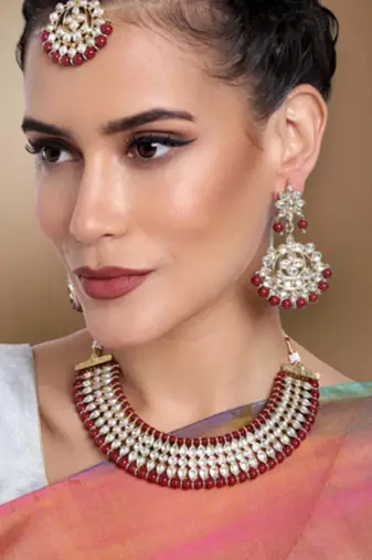 gold-plated kundan-studded jewellery set