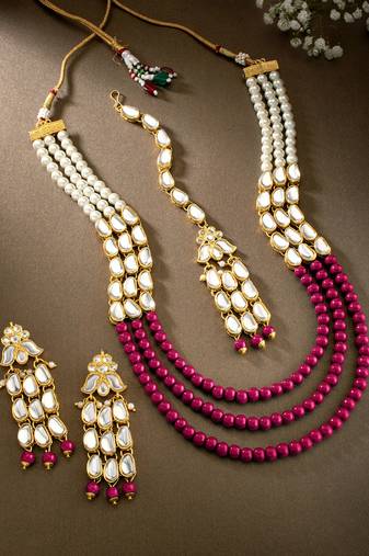 magenta gold-plated kundan studded jewellery set