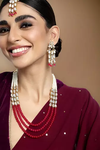 magenta gold-plated kundan studded jewellery set