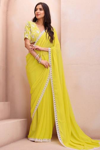 yellow embroidered saree with blouse piece