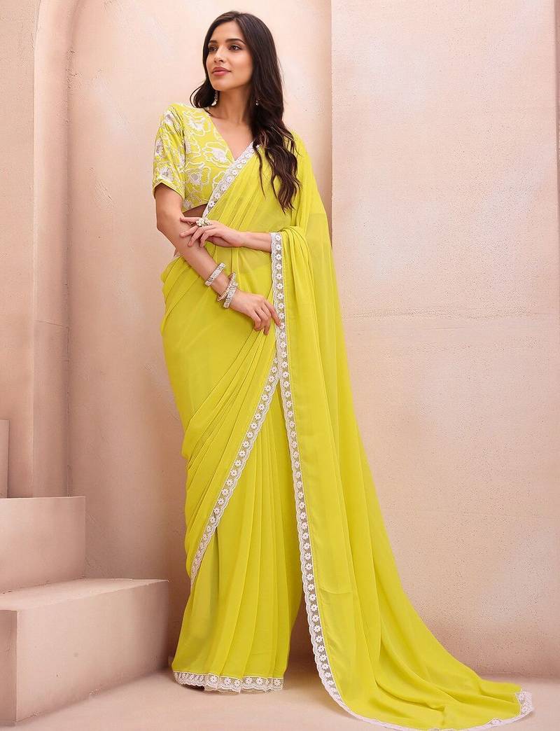 yellow embroidered saree with blouse piece