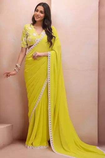 yellow embroidered saree with blouse piece