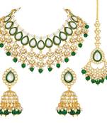 gold-plated kundan studded choker jewellery set with maang tikka