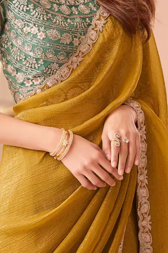 mustard embelished beads and stones pure georgette saree