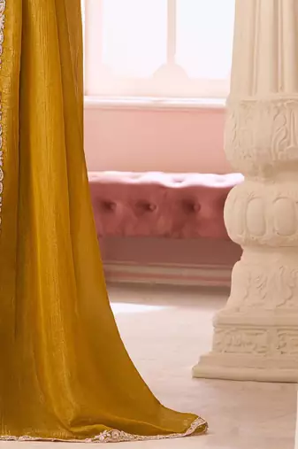 mustard embelished beads and stones pure georgette saree