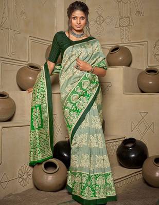 green green & cream-coloured ethnic motifs art silk ikat saree 1