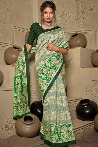 green green & cream-coloured ethnic motifs art silk ikat saree