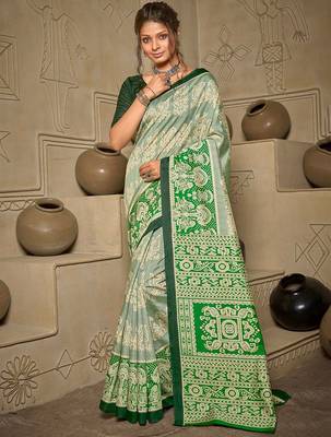 green green & cream-coloured ethnic motifs art silk ikat saree 2