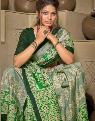 green green & cream-coloured ethnic motifs art silk ikat saree 3