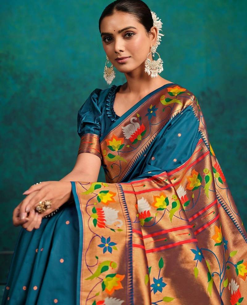 green woven designed zari paithani saree