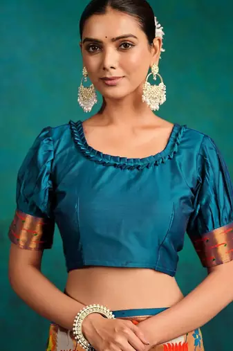 green woven designed zari paithani saree
