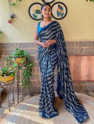 teal sequinned pure georgette saree 1