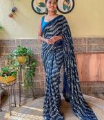 teal sequinned pure georgette saree