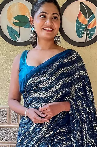 teal sequinned pure georgette saree