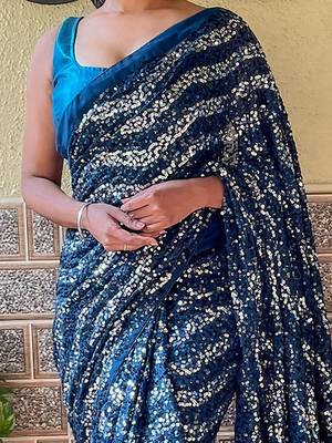 teal sequinned pure georgette saree 4