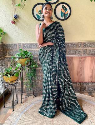 green sequinned poly georgette saree 1