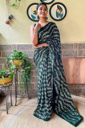 green sequinned poly georgette saree