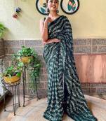 green sequinned poly georgette saree