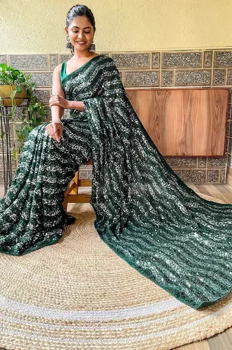 green sequinned poly georgette saree