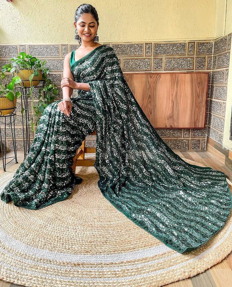 green sequinned poly georgette saree