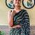 green sequinned poly georgette saree