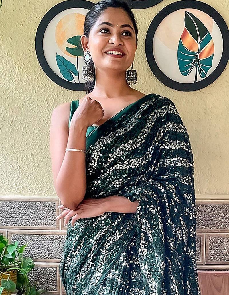 green sequinned poly georgette saree