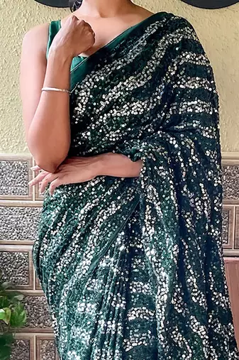 green sequinned poly georgette saree